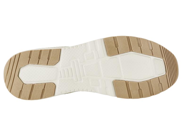 Semelle de chaussure avec une texture beige et blanche.