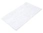 Tapis de bain blanc moelleux.
