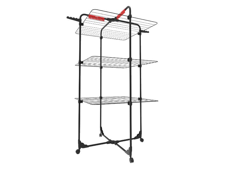 Séchoir à linge Vileda noir à trois niveaux avec détails rouges et roulettes.