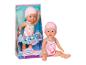 Poupée bébé en maillot de bain flamant rose et bonnet de bain, dans et hors de la boîte.