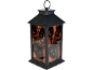 Lanterne noire d'Halloween avec lueur orange, découpes de citrouille et texte 'Happy Halloween'