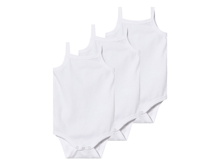 Trois bodies bébé blancs à bretelles fines.