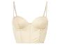 Un bustier en satin beige avec armatures.