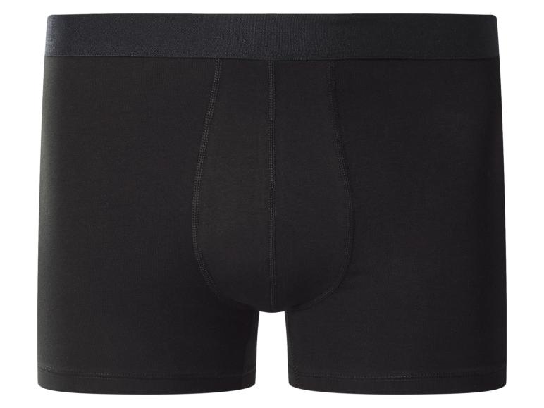 Caleçon boxer noir pour homme avec ceinture élastique.