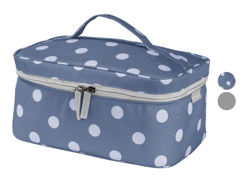 Une trousse de toilette bleue à pois blancs avec le logo Topmove.