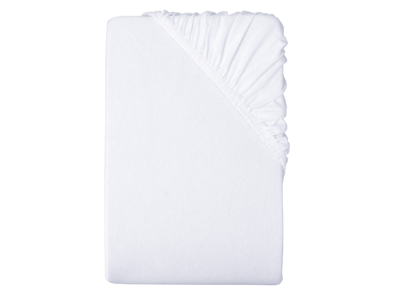 Drap-housse blanc pour lit bébé.