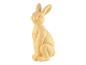 Une figurine de lapin jaune pastel.