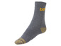 Chaussettes Caterpillar grises avec des accents jaunes.