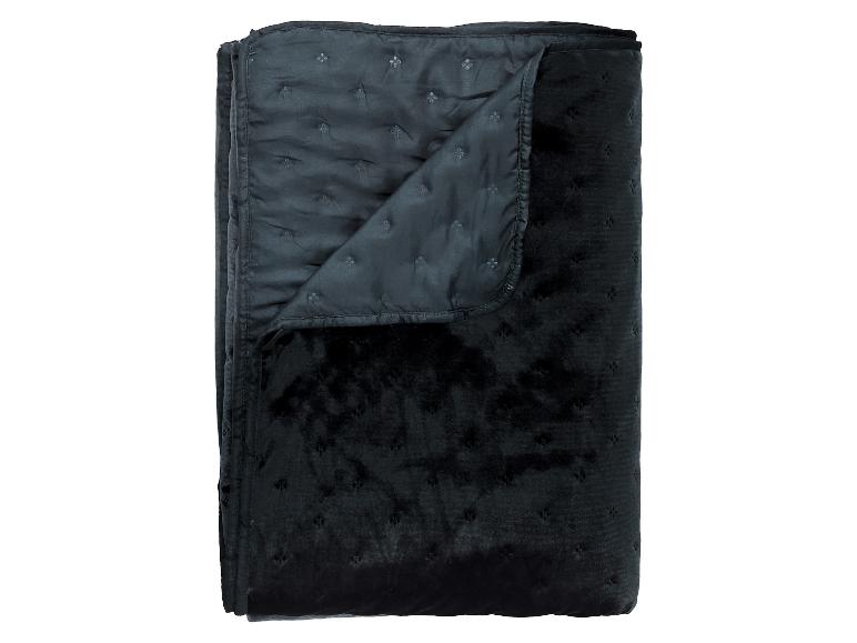 Couverture matelassée en velours noir, pliée