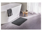 Un tapis de bain gris pour la salle de bain.