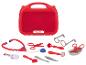Trousse de docteur rouge Lupilu avec stéthoscope, lunettes et instruments médicaux jouets.