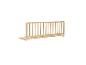 Barrière de lit en bois avec fixations blanches.