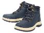 Une paire de bottes d'hiver bleu marine avec une semelle beige et des lacets à pois.