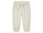 Pantalon bébé en mousseline de coton beige clair.