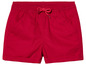 Short rouge avec taille élastique et cordon.