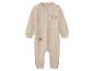 Grenouillère bébé beige avec motif Winnie l'Ourson endormi sur la lune.