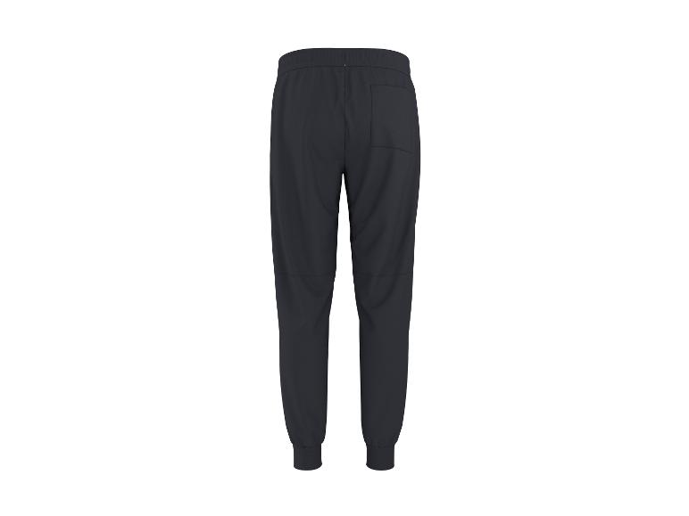 Pantalon de jogging bleu foncé pour homme avec taille et chevilles élastiques, vu de dos.