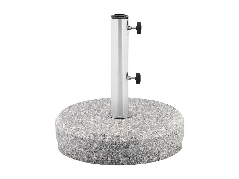 Pied de parasol rond en granit avec mât argenté.