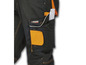 Pantalon de travail noir avec des accents orange et la marque Parkside.