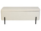 Un banc de rangement en fourrure blanche avec des pieds noirs.