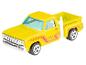 Une camionnette Dodge Hot Wheels jaune.
