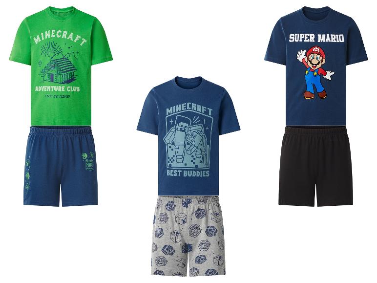 Trois ensembles de pyjamas courts pour garçons sur le thème des jeux : vert avec une maison, bleu avec des personnages et bleu avec Mario.