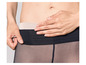 Collants noirs avec une large bande de taille beige.