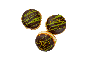 Trois beignets de style Dubaï avec glaçage au chocolat et pistaches.