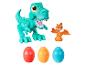 Un Tyrannosaurus Rex vert, un Pterodactyle orange et trois œufs Play-Doh.