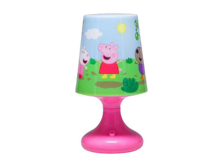 Lampe de table rose avec motif de cochons et amis dans une prairie.