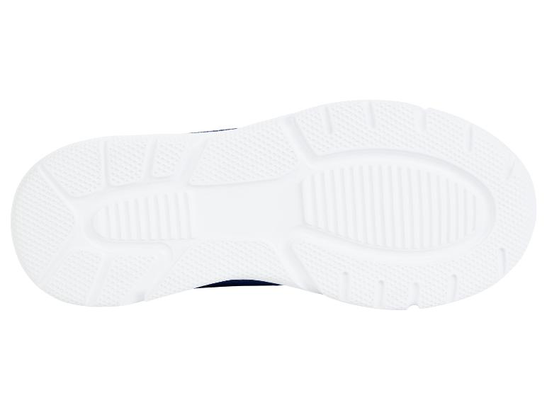 Semelles de baskets blanches avec dessus bleu marine.