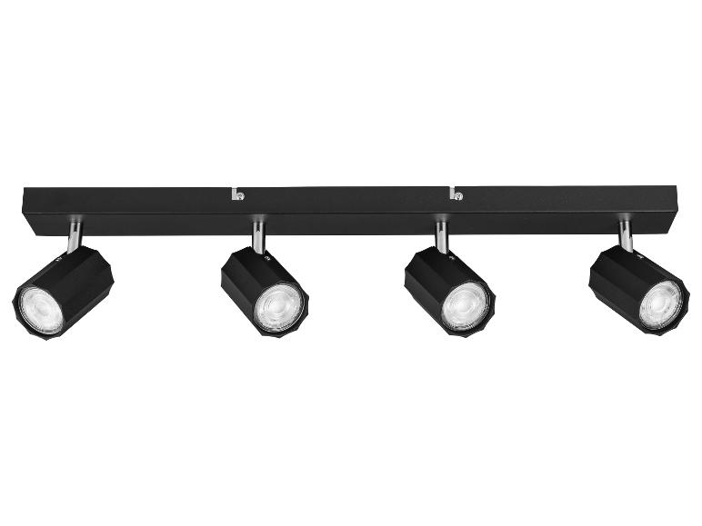 Spot encastré noir à quatre lumières avec réflecteurs orientables.