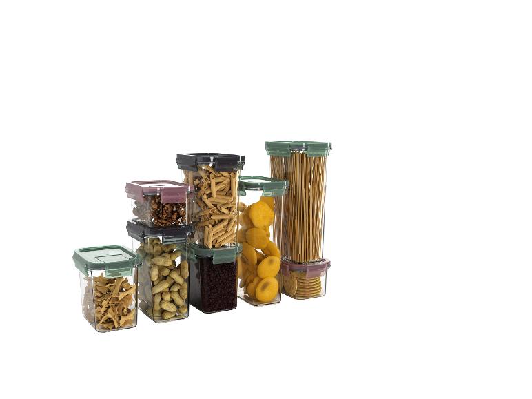 Conteneurs alimentaires transparents avec pâtes, noix, café et biscuits.