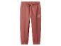 Pantalon de jogging rose pour enfant avec motif soleil.