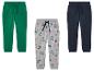 Trois pantalons de jogging pour garçons, un vert, un gris avec des dinosaures et un bleu foncé.