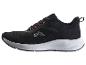 Chaussures de sport noires avec détails orange et semelle blanche