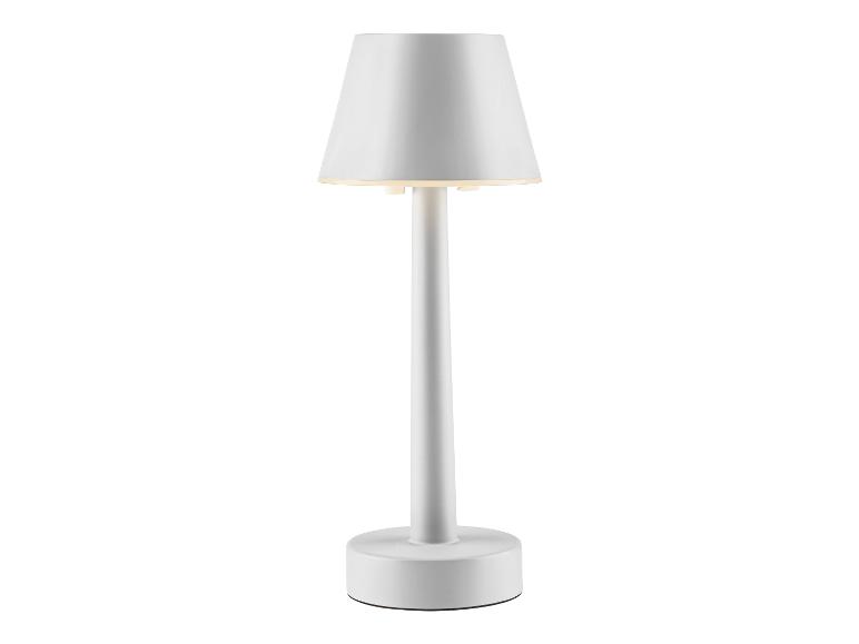 Une lampe de table blanche avec un abat-jour rond.