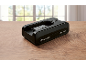 Batterie noire 24V 4.0Ah sur une table en bois.