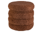 Pile de quatre coussins ou poufs ronds, marron et texturés.