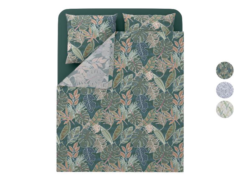 Parure de lit avec motif feuilles tropicales dans les tons verts, marrons et bleus.