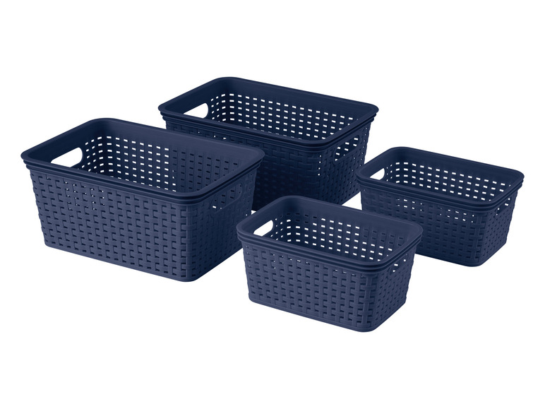 Quatre paniers de rangement bleus avec un motif tissé.