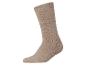Une chaussette en laine beige unie sur fond blanc.