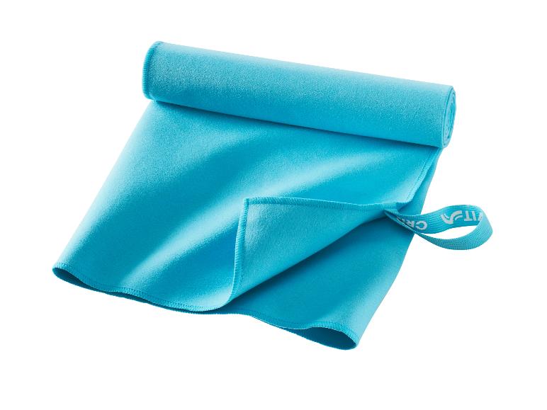 Serviette de sport turquoise, compacte et légère.