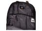 Intérieur d'un sac à dos noir avec une poche zippée et des logos.
