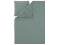 Parure de lit verte avec taie d'oreiller et housse de couette, montrant une double texture.