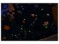 Literie et coussins sur le thème de l'espace qui brillent dans le noir, pour une chambre d'enfant.