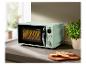 Four à micro-ondes SilverCrest rétro vert menthe dans une cuisine moderne.
