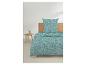 Housse de couette et taie d'oreiller à motif géométrique turquoise et gris, sur un lit avec tête de lit en bois.