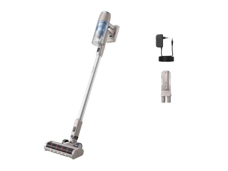 Aspirateur balai Philips : appareil, chargeur et support mural.