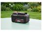 Batterie PARKSIDE 20V 4 Ah sur une table dans un jardin